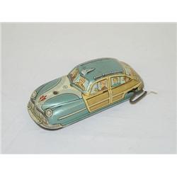 7" MARX TIN LITHO WIND-UP 4 DOOR COUPE W/ WOOD PANELING