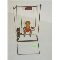 12" TIN LITHO WIND-UP BOY ON TRAPEZE "TIK-TAK"