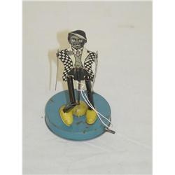 6 1/2" TIN LITHO DANCING BLACK MAN W/ BLACK & WHITE CHECKERE