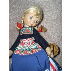 Old Cottage Doll with braids carrying a basket #1554753