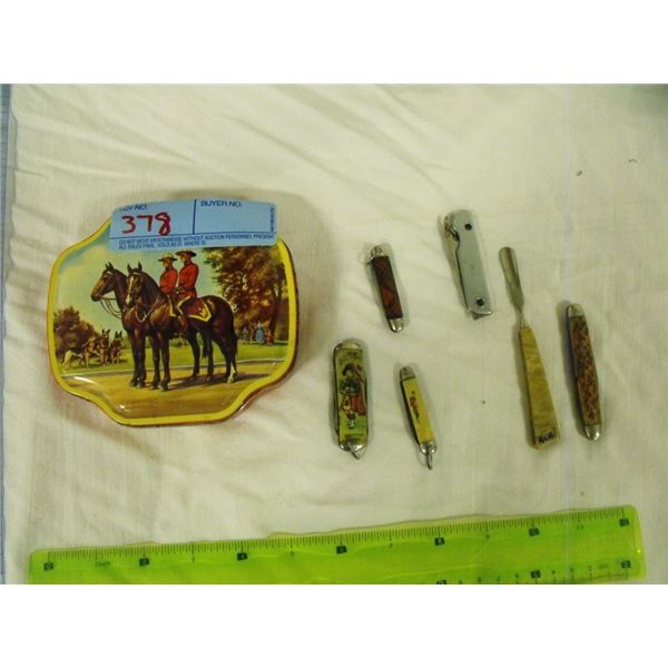 Vintage pocket knives in RCMP tin