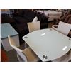 Image 2 : GLASSTOP DINING TABLE WITH SWIVEL OUT LEAFS AND 4 LEATHER CHAIRS RETAIL $1899