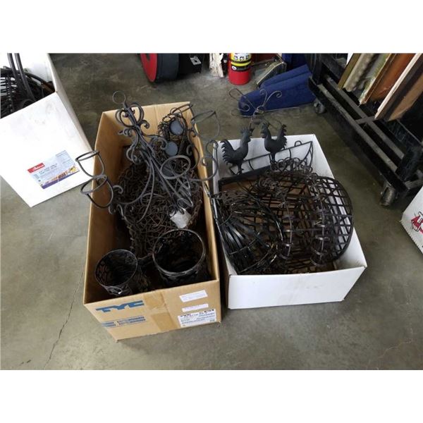 Two boxes of decorative metal items