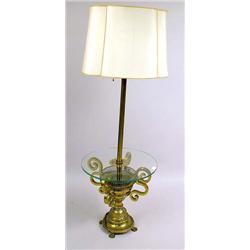 A BRASS AND GLASS FLOOR LAMP TABLE