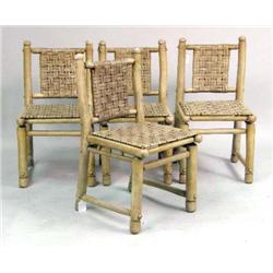 FOUR ROUGH HEWN RUSH SEATED SIDE CHAIRS