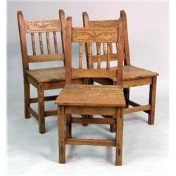 A GROUP OF THREE PINE STEPPED CARVED PLANK CHAIRS
