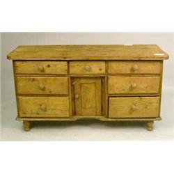A PROVINCIAL TURNED OAK AND PINE KNEEHOLE DESK