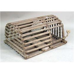 A WEATHERED LOBSTER TRAP