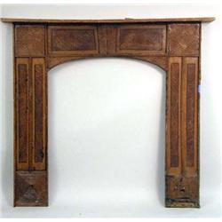 AN EMPIRE CARVED AND FAUX-GRAIN PAINTED PINE MANTLE