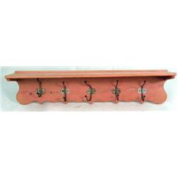 A SALMON-PAINTED PINE AND WROUGHT-IRON SHELF-FORM COAT RACK