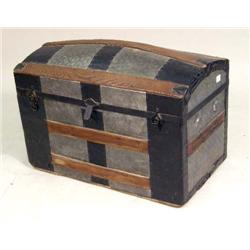 A VAULTED TIN-DECORATED TRUNK