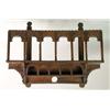 Image 1 : A CARVED AND STAINED WOOD HANGING WALL SHELF