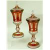 Image 1 : A PAIR OF MOLDED CRANBERRY CUT-TO-CLEAR COVERED URNS