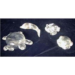 A GROUP OF STEUBEN COLORLESS GLASS FIGURES