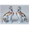 Image 1 : A PAIR OF POLYCHROME AND PARCEL GILT DECORATED SEATED DOGS