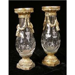 A PAIR OF LOUIS XVI STYLE METAL MOUNTED COLORLESS GLASS URNS