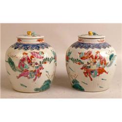 A PAIR OF POLYCHROME AND FIGURAL-DECORATED PORCELAIN COVERED GINGER JARS