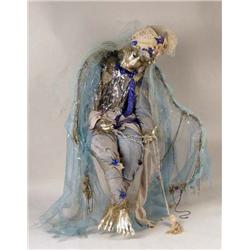 A LIMITED EDITION MIXED MEDIA SEATED DOLL