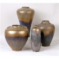 A GROUP OF FOUR EARTHENWARE VASES