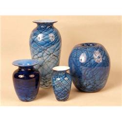 A GROUP OF FOUR BLUE MARBLEIZED ART GLASS VASES