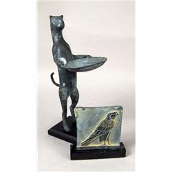 A PATINATED METAL SCULPTURE OF A CAT