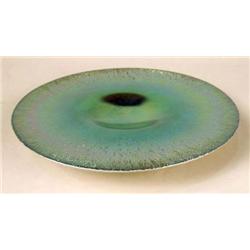 AN IRIDESCENT ART GLASS CIRCULAR FOOTED SERVING PLATTER