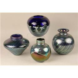 FOUR IRIDESCENT ART GLASS CIRCULAR VASES