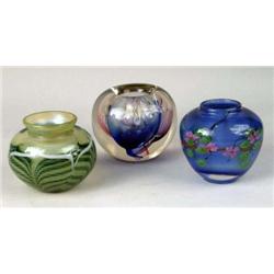 A GROUP OF THREE ART GLASS CIRCULAR VASES