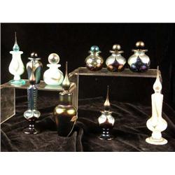 A GROUP OF TEN IRIDESCENT GLASS MINIATURE PERFUME BOTTLES