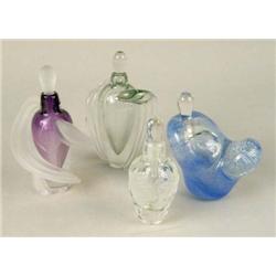 A GROUP OF FOUR GLASS PERFUME BOTTLES