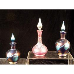 A GROUP OF THREE IRIDESCENT GLASS PERFUME BOTTLES