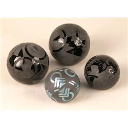 A GROUP OF ONYX AND FROSTED GLASS PAPERWEIGHTS