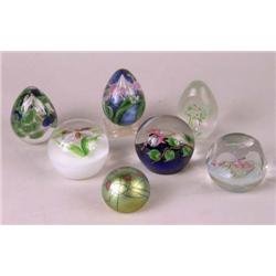 A GROUP OF SEVEN GLASS PAPERWEIGHTS