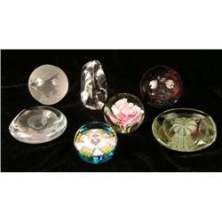 A GROUP OF SEVEN GLASS PAPERWEIGHTS