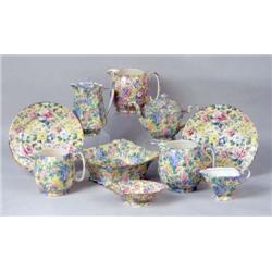 AN ASSORTED GROUP OF POLYCHROME PARCEL-GILT TABLE ARTICLES