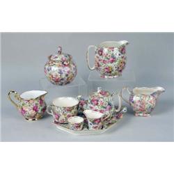 A GROUP OF ASSORTED POLYCHROME AND PARCEL-GILT CHINTZ PORCELAIN TABLE ARTICLES