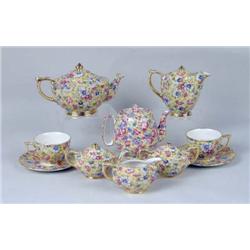 A GROUP OF POLYCHROME-DECORATED PARCEL-GILT CHINTZ TABLE ARTICLES