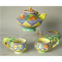 A CERAMIC POLYCHROME-DECORATED LIZARD-MOTIF TEAPOT