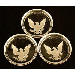 A GROUP OF EIGHTEEN COLORLESS GLASS COASTERS