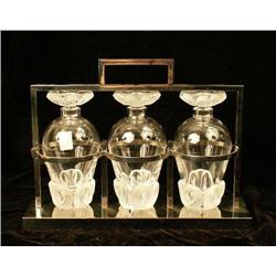 A GROUP OF THREE MATCHING COLORLESS GLASS STOPPERED DECANTERS