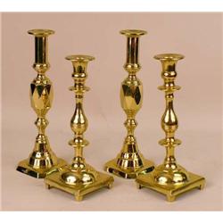 TWO PAIRS OF BRASS CANDLESTICKS