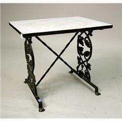 A BLACK-PAINTED MARBLE-INSET CAST-IRON SIDE TABLE
