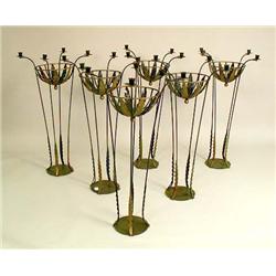 A GROUP OF SIX GREEN PAINTED AND GILT DECORATED PATINATED METAL URN-FORM CENTERPIECES