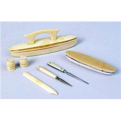 A GROUP OF BONE NAIL ACCESSORIES