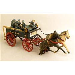 A CAST-IRON PAINT-DECORATED POLICE WAGON TOY