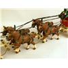 Image 3 : A CAST IRON POLYCHROME PAINT DECORATED BEER WAGON TOY