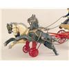 Image 2 : A CAST IRON POLYCHROME PAINT-DECORATED FIRE PUMPER TOY