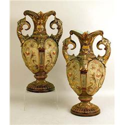 A PAIR OF POLYCHROME-DECORATED MAJOLICA URNS