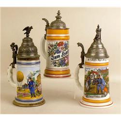 A GROUP OF THREE GLAZED CERAMIC BEER STEIN