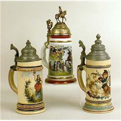 A GROUP OF THREE GLAZED CERAMIC BEER STEIN